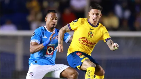 Willer Ditta of Cruz Azul battles for possession with Brian Rodriguez of America