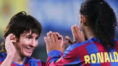 Lionel Messi (L) and Ronaldinho of Barcelona celebrate after beating Villarreal 2-0 during the Primera Liga match