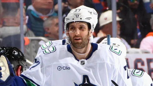 Derek Forbort #27 of the Vancouver Canucks celebrates his second period goal against the New York Islanders at UBS Arena on March 26, 2025 in Elmont, New York.