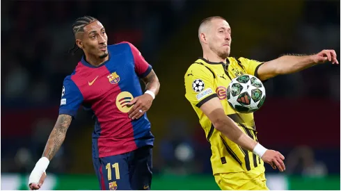 Waldemar Anton of Borussia Dortmund controls the ball whilst under pressure from Raphinha of FC Barcelona