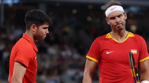 Rafael Nadal (R) and partner Carlos Alcaraz of Team Spain look dejected during the 2024 Paris Olympic Games.