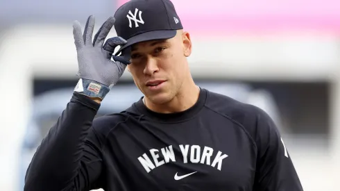Aaron Judge #99 of the New York Yankees adjusts his hat during batting practice before the game against the Kansas City Royals at Yankee Stadium on April 15, 2025 in the Bronx borough of New York City. All players are wearing the number 42 in honor of Jackie Robinson Day.