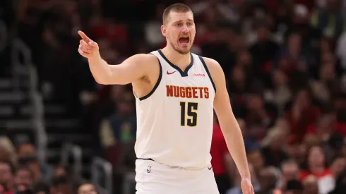 Nikola Jokic #15 of the Denver Nuggets looks on against the Chicago Bulls during the first half at the United Center.