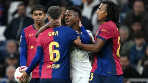 Barcelona and Real Madrid players having a heated argument during a La Liga game