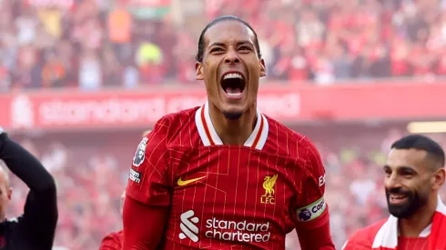 Virgil van Dijk of Liverpool celebrates the teams victory and confirmation of winning the Premier League title in the Premier League match between Liverpool FC and Tottenham Hotspur FC at Anfield on April 27, 2025 in Liverpool, England.