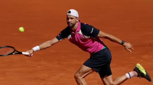 Grigor Dimitrov of Bulgaria plays a forehand against Jacob Fearnley of Great Britain during the Round of 32 match on Day Seven of the Mutua Madrid Open at La Caja Magica on April 28, 2025 in Madrid, Spain.