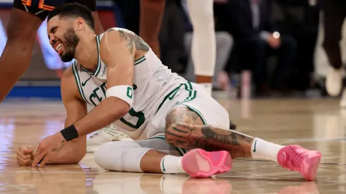 Jayson Tatum #0 of the Boston Celtics lays on the ground after being injured against the New York Knicks.