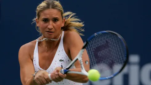 Tatiana Golovin of France returns a shot against Jelena Jankovic of Serbia during the Rogers Cup.