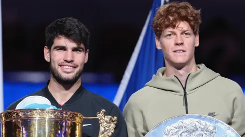 Carlos Alcaraz of Spain and Jannik Sinner of Italy poses with the winners trophy after the China Open.