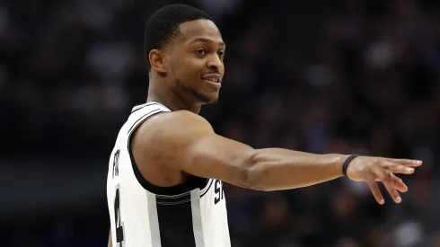 De'Aaron Fox #4 of the San Antonio Spurs points back towards the Sacramento Kings' bench before his first game back in Sacramento after being traded from the Sacramento Kings at Golden 1 Center on March 07, 2025 in Sacramento, California.