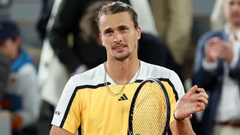 Alexander Zverev of Germany celebrates winning match point against Alex De Minaur of Australia during the Men's Singles Quarter Final match on Day 11 at Roland Garros on June 05, 2024.