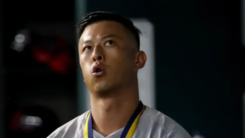 Rob Refsnyder #30 of the Boston Red Sox walks in the dugout after hitting a home run against the Texas Rangers at Globe Life Field on August 03, 2024 in Arlington, Texas.