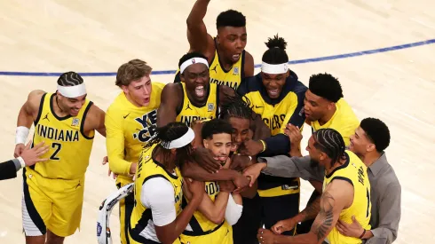 Tyrese Haliburton of the Indiana Pacers is congratulated by his teammates after scoring a game-tying basket in Game One of the Eastern Conference Finals of the 2025 NBA Playoffs.