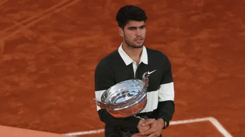 Carlos Alcaraz of Spain holds the Coupe des Mousquetaires trophy following his victory over Jannik Sinner of Italy in the Men’s Singles Final match on Day Fifteen of the 2025 French Open at Roland Garros on June 08, 2025 in Paris, France.