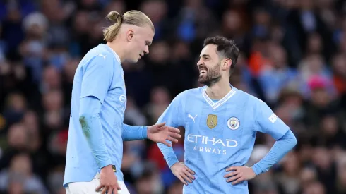Bernardo Silva of Manchester City celebrates scoring his team's second goal with teammate Erling Haaland during the Emirates FA Cup Quarter Final match between Manchester City and Newcastle United.