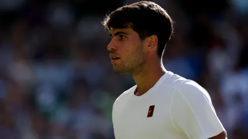 Carlos Alcaraz of Spain reacts against Fabio Fognini of Italy during the Gentlemen's Singles first round match on day one of The Championships Wimbledon 2025 at All England Lawn Tennis and Croquet Club on June 30, 2025 in London, England.