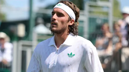 Stefanos Tsitsipas of Greece reacts as he retires against Valentin Royer of France during Wimbledon.