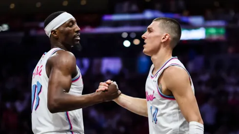 Bam Adebayo (L) #13 of the Miami Heat and Tyler Herro #14 of the Miami Heat reacts during the fourth quarter against the Atlanta Hawks at Kaseya Center on March 27, 2025 in Miami, Florida. NOTE TO USER: User expressly acknowledges and agrees that, by downloading and or using this photograph, User is consenting to the terms and conditions of the Getty Images License Agreement.