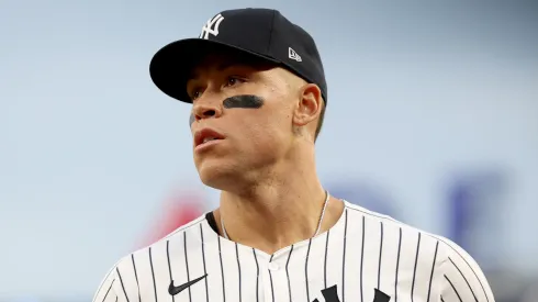 Aaron Judge #99 of the New York Yankees heads back to the dugout during the game against the Toronto Blue Jays at Yankee Stadium on April 25, 2025 in the Bronx borough of New York City.