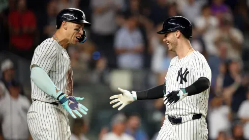 Cody Bellinger #35 celebrates with Aaron Judge #99 of the New York Yankees following Bellinger's eighth inning two run home run against the Chicago Cubs at Yankee Stadium on July 11, 2025 in New York City.