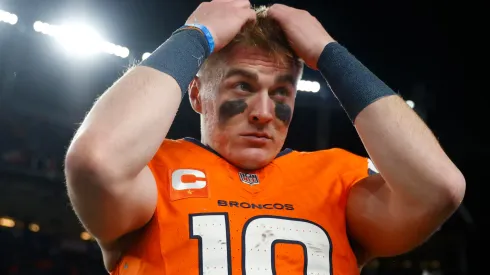 Bo Nix #10 of the Denver Broncos walks off the field after defeating the Indianapolis Colts 31-13 at Empower Field At Mile High on December 15, 2024 in Denver, Colorado.