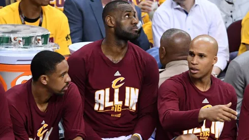 Channing Frye #9, LeBron James #23 and Richard Jefferson #24 of the Cleveland Cavaliers look on from the bench in the second half against the Toronto Raptors.