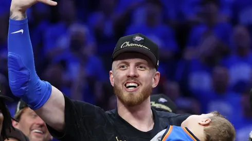 Isaiah Hartenstein #55 of the Oklahoma City Thunder celebrates with his son Elijah after defeating the Indiana Pacers 103-91 in Game Seven of the 2025 NBA Finals