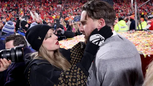 Taylor Swift celebrates with Travis Kelce #87 of the Kansas City Chiefs.