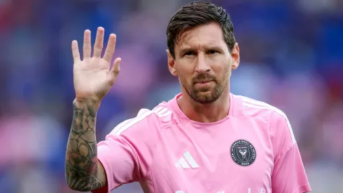 Lionel Messi waves to crowd.