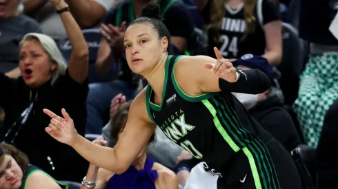 Kayla McBride #21 of the Minnesota Lynx reacts after scoring during the second quarter against the Indiana Fever in 2025.