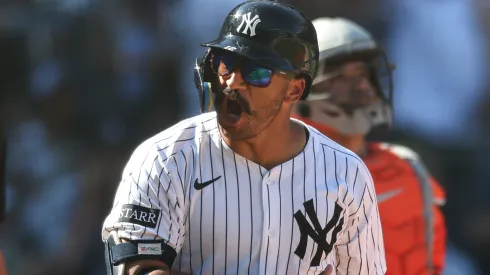 Trent Grisham #12 of the Yankees reacts after hitting a three-run home run.