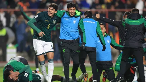 Efraín Morales of Bolivia and teammates celebrate after winning.