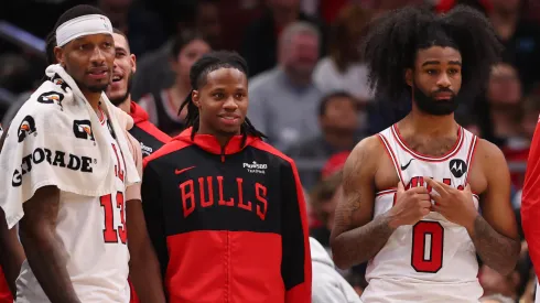 Torrey Craig #13, DJ Steward #00, Coby White #0 of the Chicago Bulls look on.