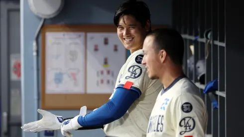 Shohei Ohtani #17 of the Los Angeles Dodgers .talks with Tommy Edman #25.