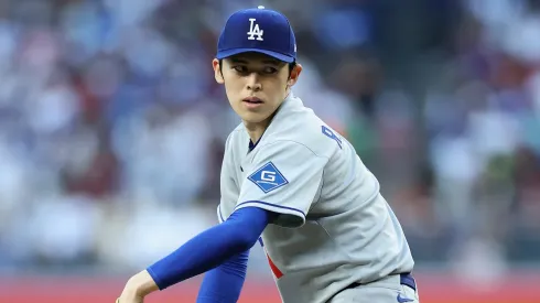 Roki Sasaki #11 of the Los Angeles Dodgers pitches.