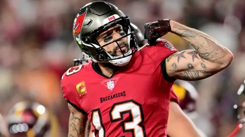 Mike Evans #13 of the Tampa Bay Buccaneers celebrates after scoring a touchdown.