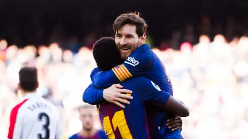 Lionel Messi of FC Barcelona celebrates with his teammate Ousmane Dembele