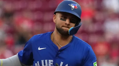Bo Bichette #11 of the Toronto Blue Jays celebrates a three-run home run as he runs the bases.