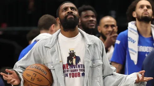 Kyrie Irving #11 of the Dallas Mavericks looks to the scoreboard.