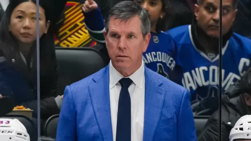New York Rangers head coach Mike Sullivan looks on during an NHL game.
