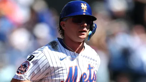 Pete Alonso #20 of the New York Mets reacts to a home run during the game.