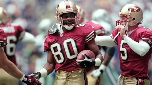 Jerry Rice #80 of the San Francisco 49ers get congradulated on his touchdown in 2000.