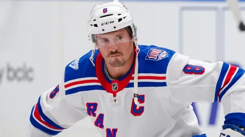 J.T. Miller #8 of the New York Rangers stretches prior to NHL action.