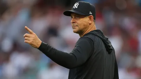 Manager Aaron Boone #17 of the New York Yankees points to the bullpen.