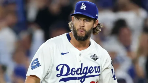 Clayton Kershaw #22 of the Dodgers celebrates after pitching the 12th inning against the Blue Jays