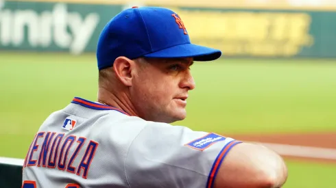 Carlos Mendoza looks on from the dugout.