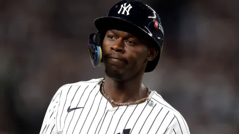Jazz Chisholm Jr. #13 of the Yankees reacts after hitting a solo home run against the Blue Jays.