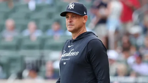 Manager Aaron Boone #17 of the New York Yankees steps out.
