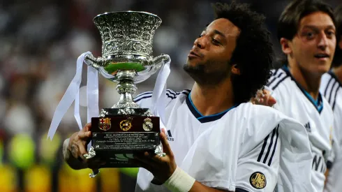 Marcelo Vieira of Real Madrid CF celebrates with the Spanish Super Cup trophy in 2012.