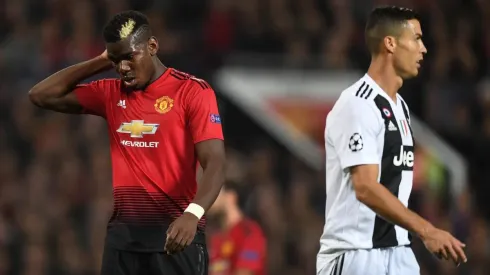 Paul Pogba y Cristiano Ronaldo en un enfrentamiento.